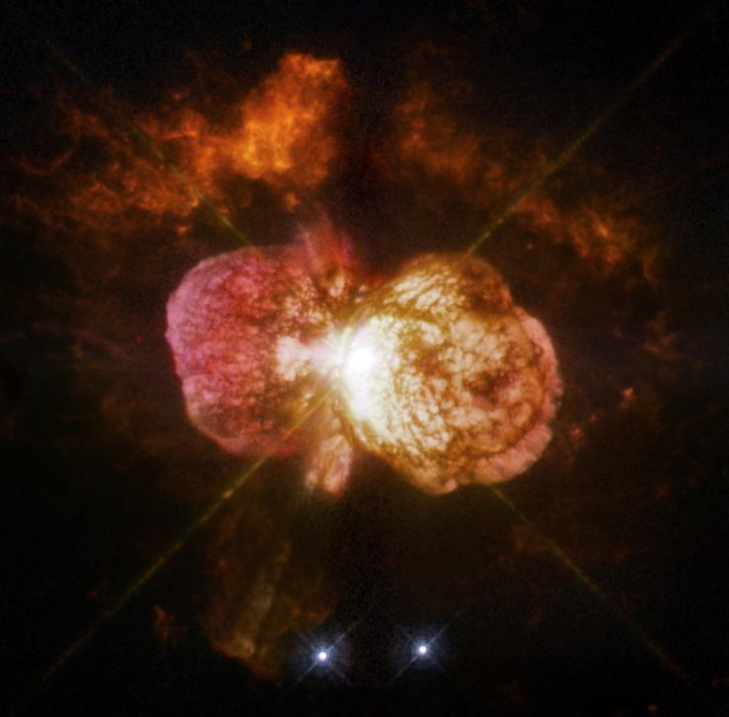 Hubble image of Eta Carinae, an hourglass-shaped glowing cloud of gas with two lobes around a bright central star